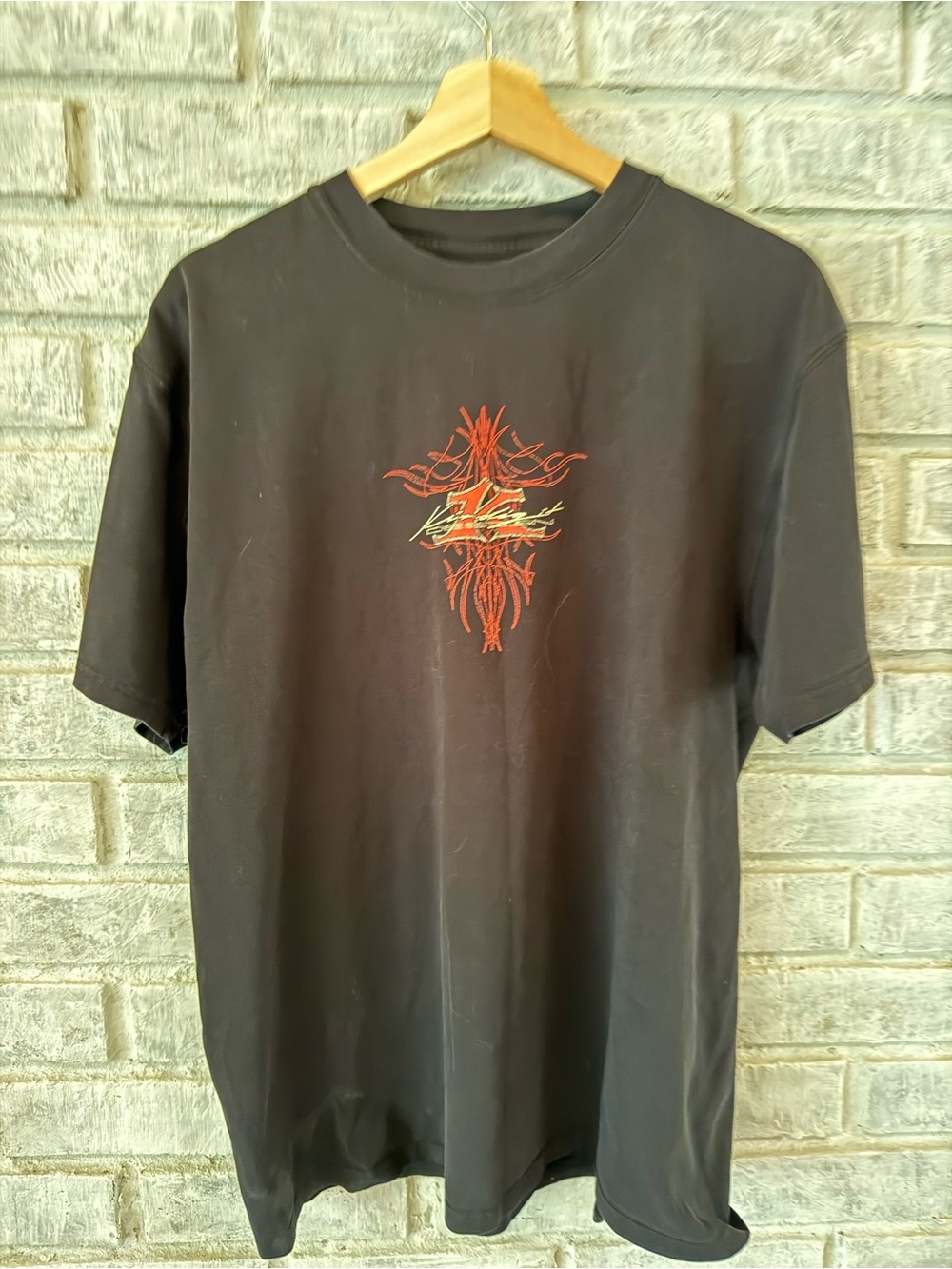 Men's Black Graphic Tee with Red Accent